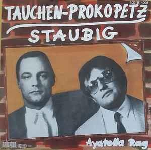 Tauchen-Prokopetz: Staubig / Ayatolla Rag - Vinile 7''