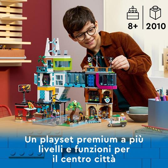 LEGO City 60380 Downtown, Modular Building Set con Negozio, Barbiere,  Studio Blogging, Hotel, Discoteca e 14 Minifigure