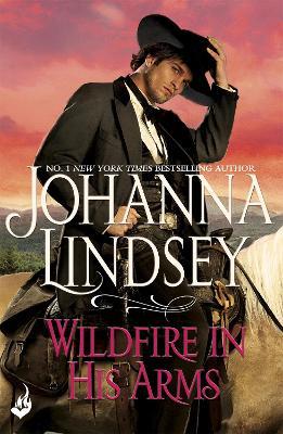 Wildfire In His Arms: A dangerous gunfighter falls for a beautiful outlaw in this compelling historical romance from the legendary bestseller - Johanna Lindsey - cover