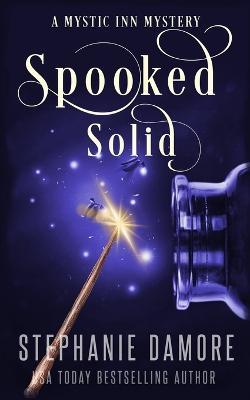 Spooked Solid: A Paranormal Cozy Mystery - Stephanie Damore - cover